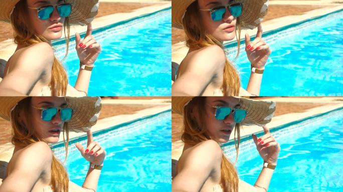 在游泳池里晒日光浴的女孩