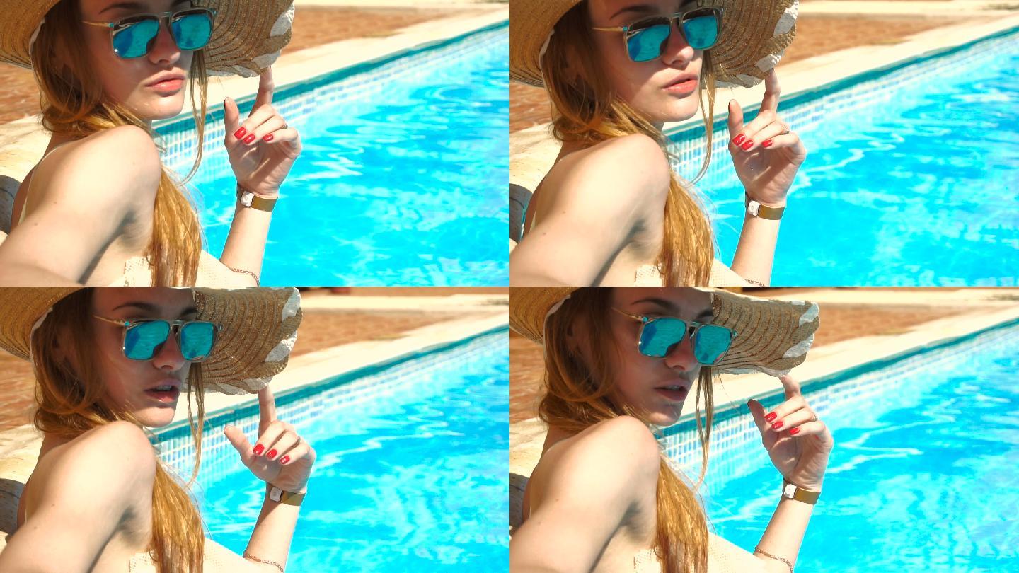 在游泳池里晒日光浴的女孩