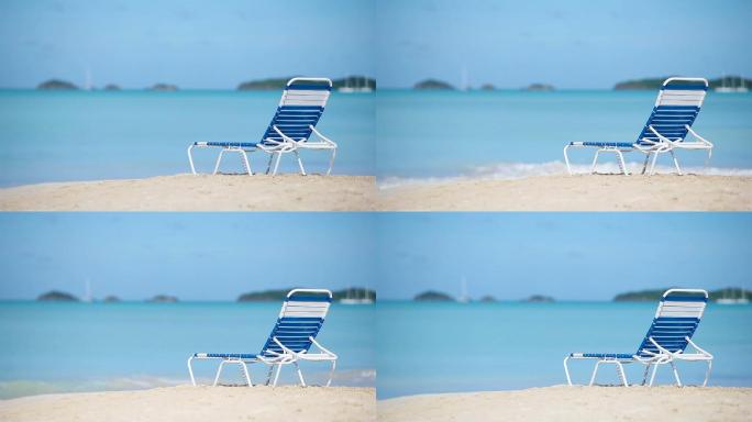 一个在白色热带海滩上的沙滩椅
