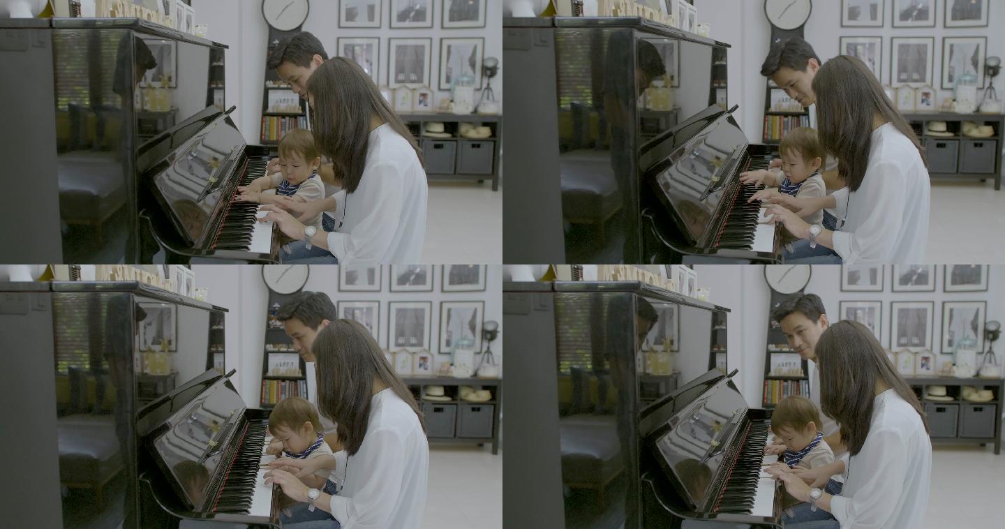 夫妻与他们的小孩演奏钢琴.