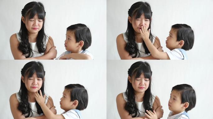 亚洲儿童在白色的背景，慢动作上哭