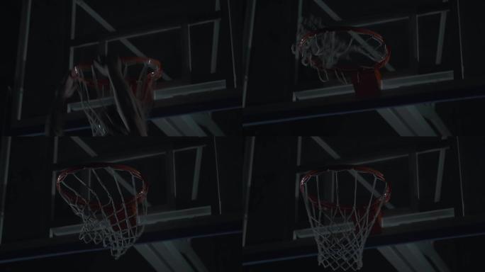 职业篮球运动员在篮球场中扣篮的特写图像.