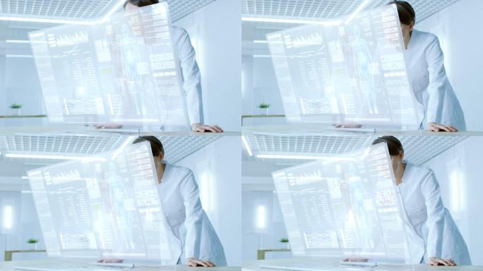 在未来的实验室中, 女性科学家在透明的计算机显示器上工作