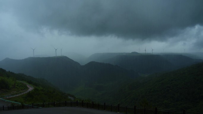 高原风力发电机电闪雷鸣暴雨乌云密布