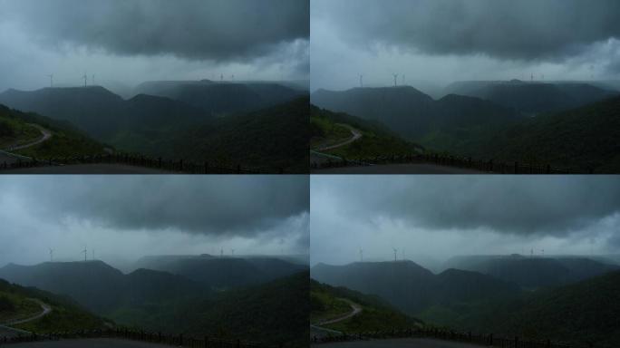 高原风力发电机电闪雷鸣暴雨乌云密布