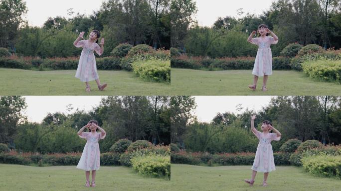 4K公园草坪上跳舞的小女孩