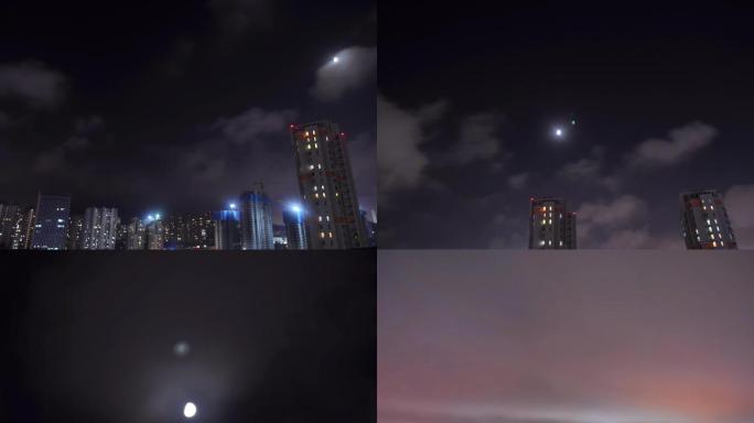城市延时拍摄夜间云和月亮