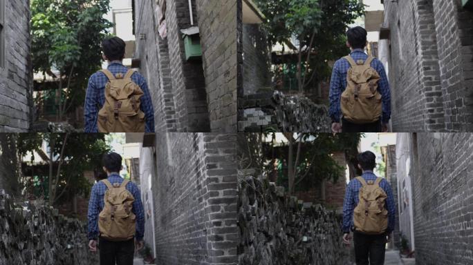 巷子里的年轻人背着书包慢动作2