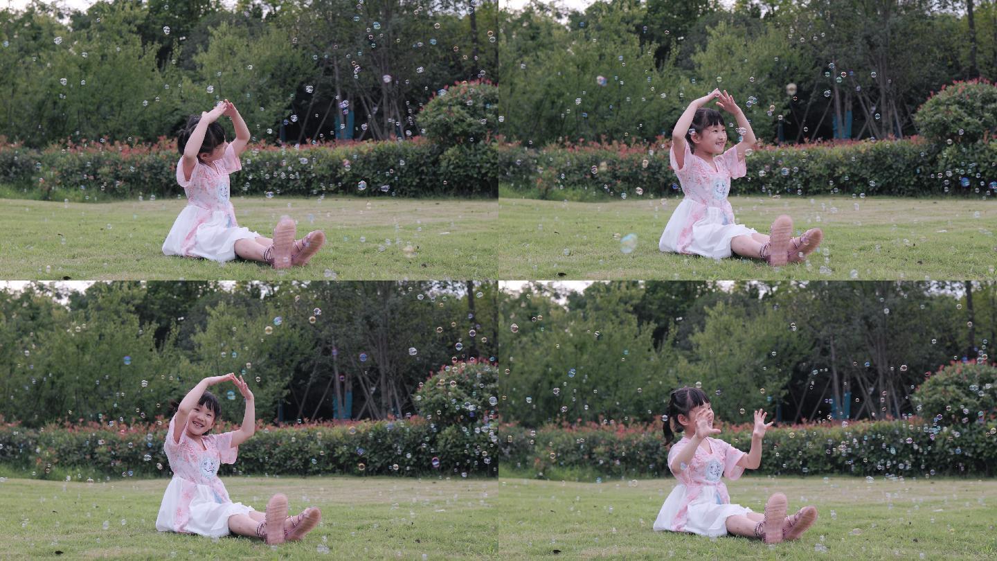 4K公园草坪上在泡泡下跳舞的小女孩
