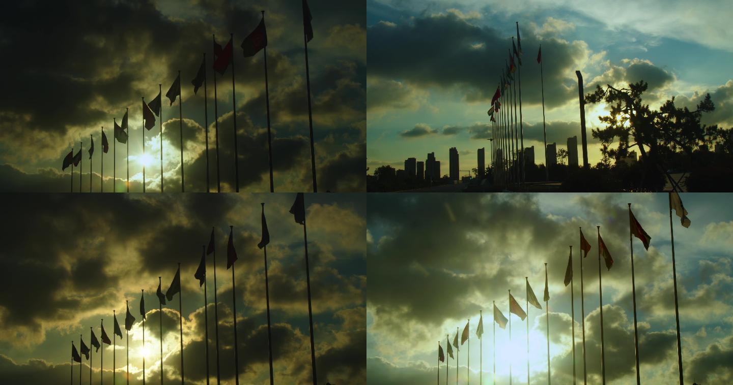 傍晚逆光拍摄的多国旗帜