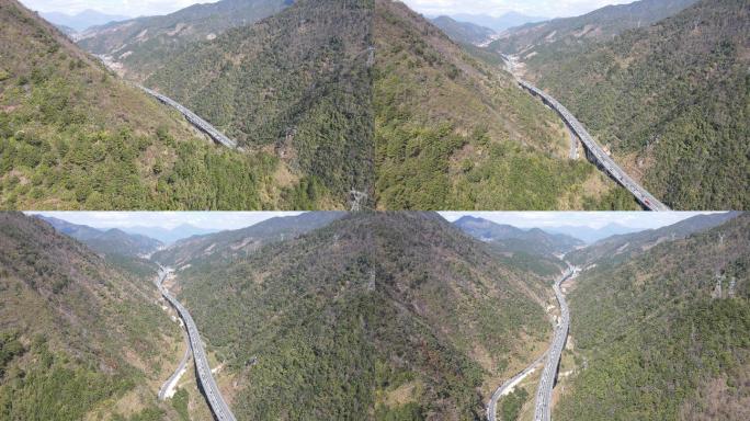 群山间高速公路车流高空航拍