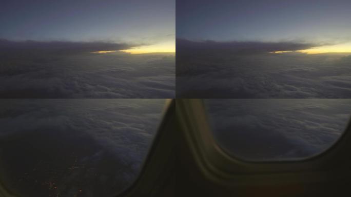 4K飞机窗口向下看乌云洞城市夜景