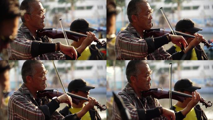 小提琴手 退休老人 公园演奏 自娱自乐