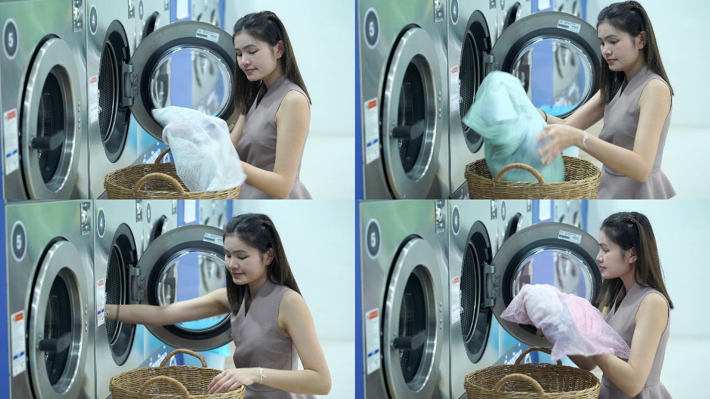 美女在一家自动洗衣店洗衣服。