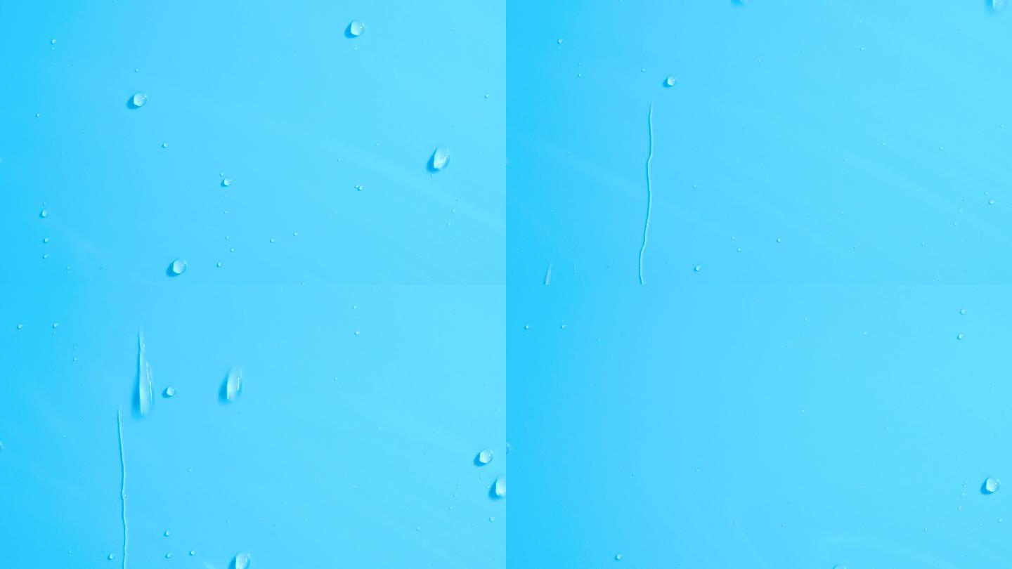 水滴慢慢地顺着蓝色的墙流下来。