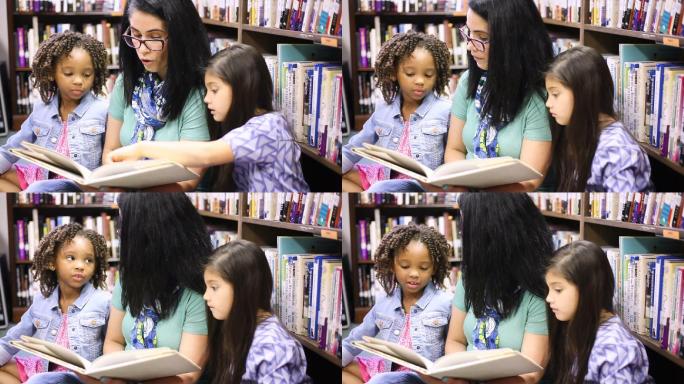 老师在图书馆给学生朗读一本书