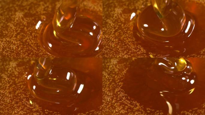 蜂蜜下落的慢运动蜜蜂巢蜂蜜马蜂窝