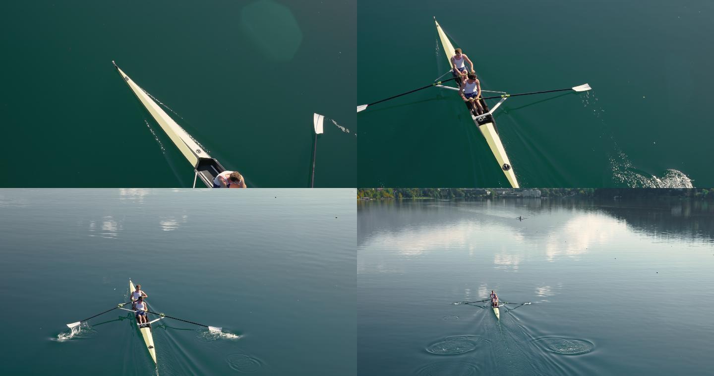 两名运动员组成的划船队在湖面上划船