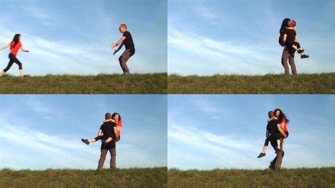 恋爱中的情侣在草地上玩