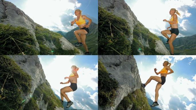 年轻女子在陡峭的岩石小道上跑上山