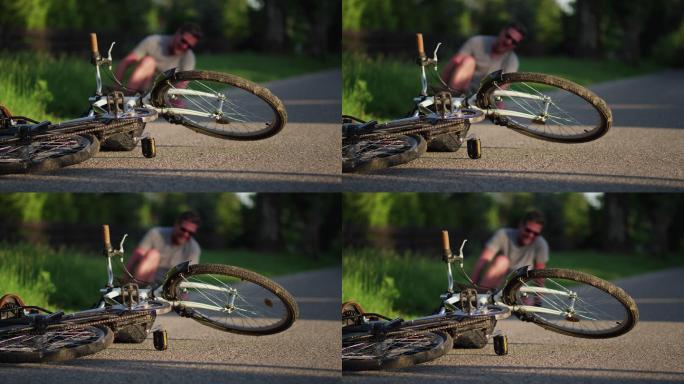 骑自行车摔倒的男人