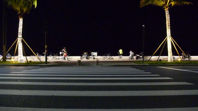 珠海夜晚海边运动散步自行车跑步