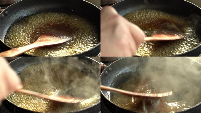 一位中国厨师在锅里制作芡汁，大火沸腾收汁