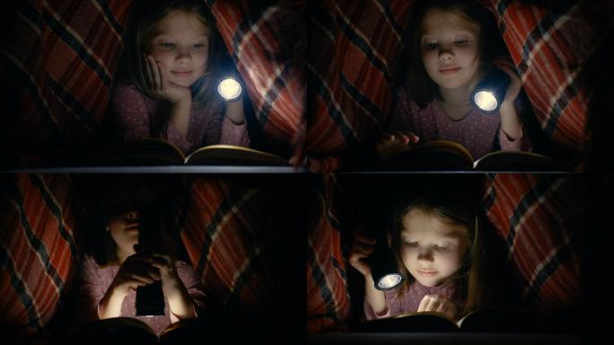 小女孩在毯子下用手电筒读书