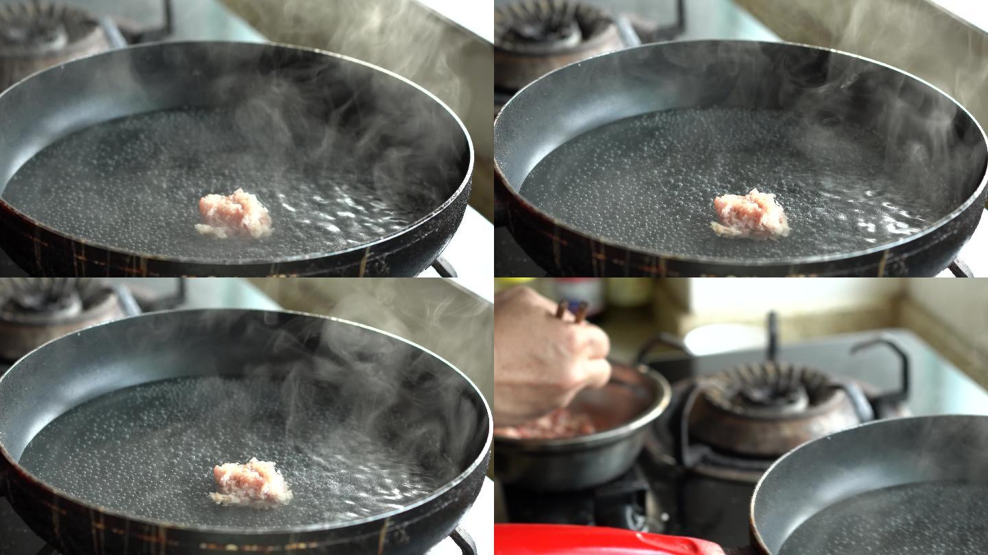 一位中国厨师在滚烫的虾眼水里制作汆肉丸子