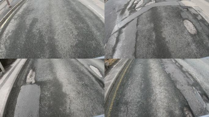 有许多坑洼的受损道路