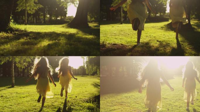 两个女孩在公园的阳光下奔跑