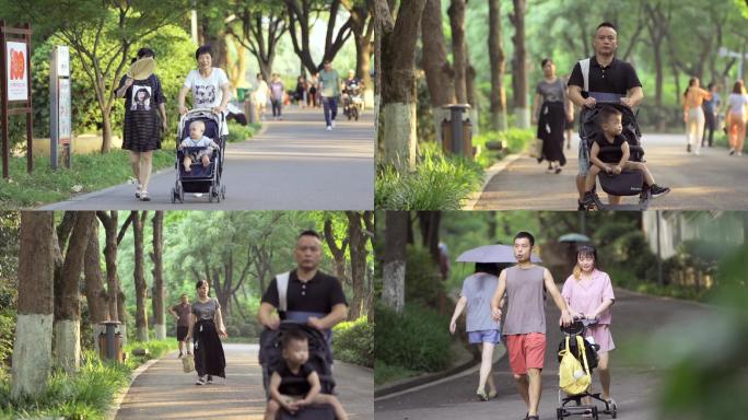 推着婴儿车带着宝宝在公园散步