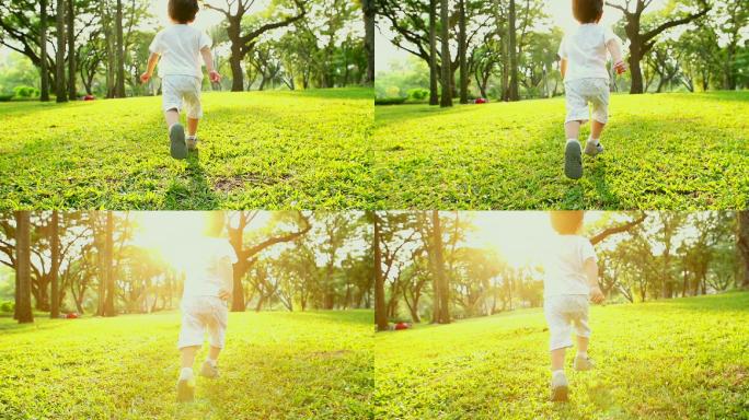小男孩在公园里奔跑，背景是日落