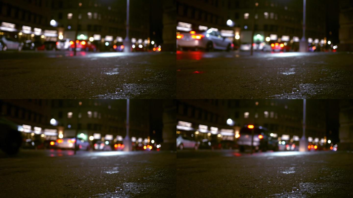 雨夜，城市里的车辆在夜间沿着城市街道行驶