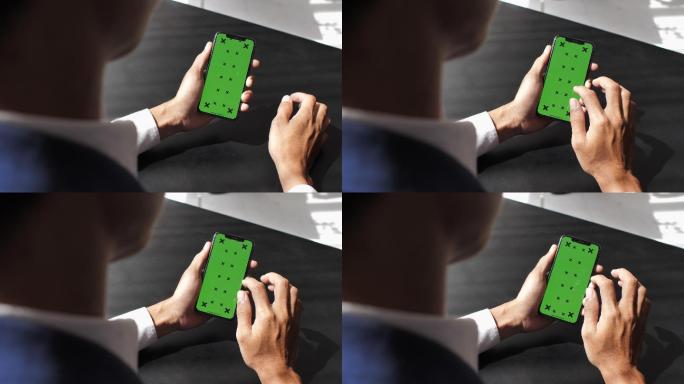 商人使用绿色屏幕智能手机
