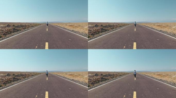 4K新疆高原笔直的公路上行走的摄影师