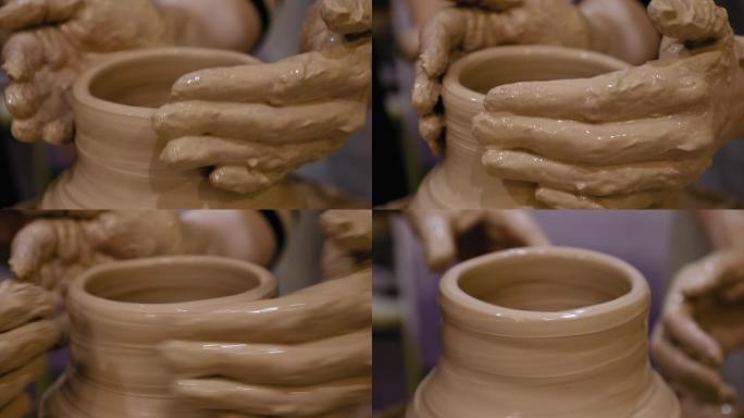 陶工正在陶工的轮子上做陶罐