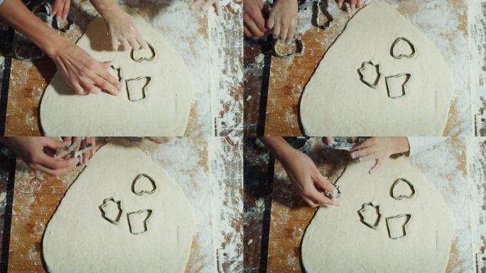 在和母亲一起制作饼干的小孩子