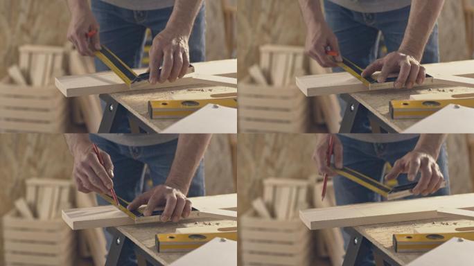 木匠用铅笔和尺子在木板上做记号