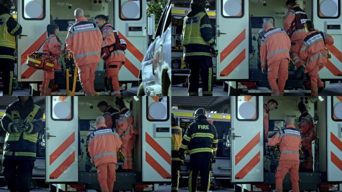 两名男性护理人员将伤者抬上救护车，女医生陪同患者