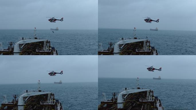救援人员从直升机下降到船上