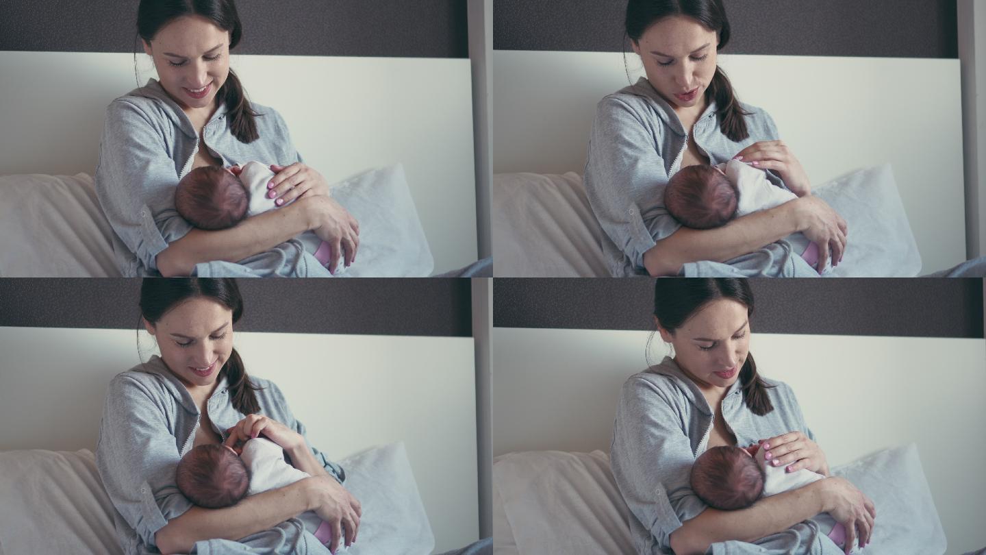 可爱的妈妈用母乳喂养可爱的宝宝