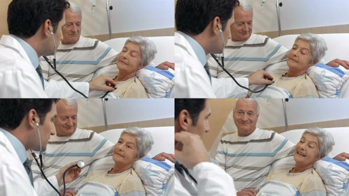 医生用听诊器倾听老年妇女的呼吸