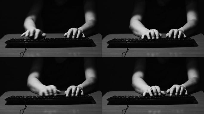 在键盘上打字的双手黑白特写