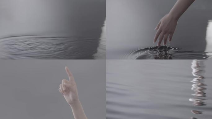 手指抚水撩起涟漪4k素材