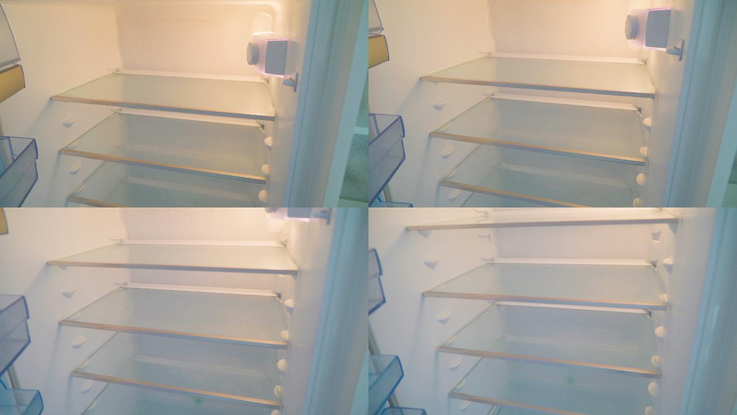 厨房冰箱内的隔板，里面没有任何物品