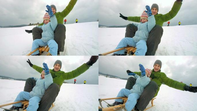 父女雪橇下山幸福旅行滑雪坡