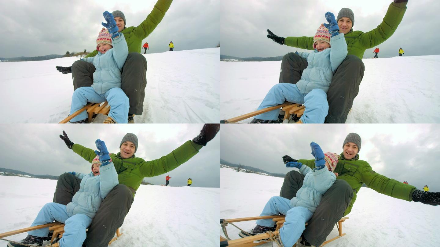 父女雪橇下山幸福旅行滑雪坡