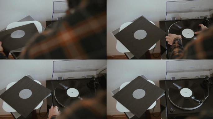 用唱片机听黑胶唱片的人