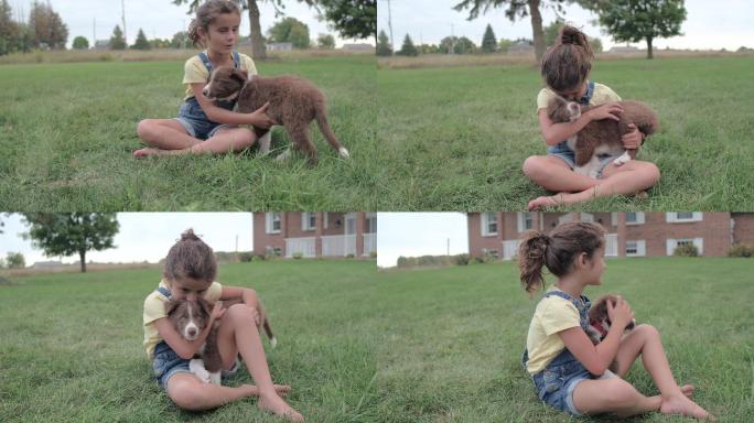 在草地上玩耍的小女孩和狗狗
